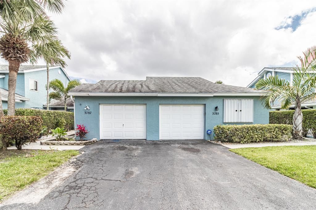 Photo of 3787 Island Club Circle Cir E, Lake Worth Beach, FL 33462 (MLS # R10795197)