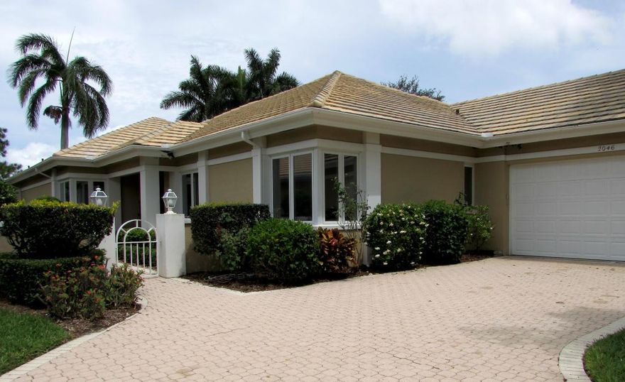 Large, lake view home in Desirable Monarch Country Club. Screened Lanai overlooks the golf course, lake and pool. This home offers 3 bedrooms and a den(or 4th) 4 full baths and an oversized 2 car garage. As you enter through the marble foyer you come into the formal dining area and spacious fireplaced living room with built in ash wood media center. This leads to the glass enclosed Florida room, screened lanai and 15*32 pool. The master suite offers custom closets, built in hide away tv console, French doors, plantation shutters, Jacuzzi tub, 2 separate toilet areas with bidet. The kitchen has a circular design open to the sitting and breakfast area and is appointed with a breakfast booth and built in wall unit. Guest suite offers two bedrooms and full bath with dual vanities The home is equipped with two water heaters, one in the master (electric) and a whole house solar powered water heater. New garage door and opener within the last 2 years.