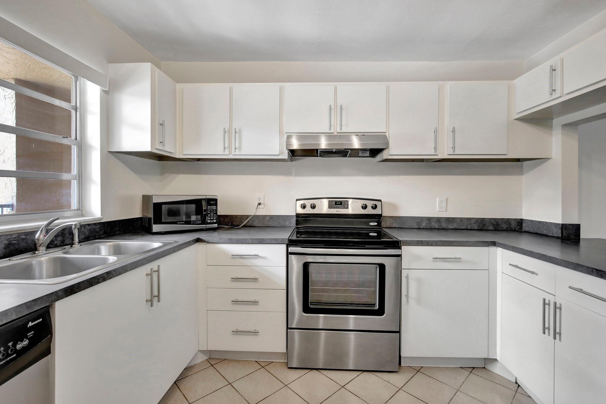 Great 2/2 condo for rent in Live Oak - Pine Island Ridge Country Club. This 3rd floor unit features vinyl wood flooring, updated kitchen with SS appliances and tranquil garden views. The building includes an elevator and laundry facilities on the same floor. The rent includes fiber internet, water, cable TV. Located just minutes from major highways, downtown Ft Lauderdale, shopping centers, restaurants, hospitals, top-rated schools, NSU and Broward College. Residents have access to pickleball, basketball courts, playground, walking trails, 3 pools, restaurants, fitness center and more. Pets under 25 lbs are welcome. Association approval is required and takes approximately 2 to 4 weeks. Minimum credit score of 650 and minimum annual income of $45,000. Association requires a $1,000 deposit.