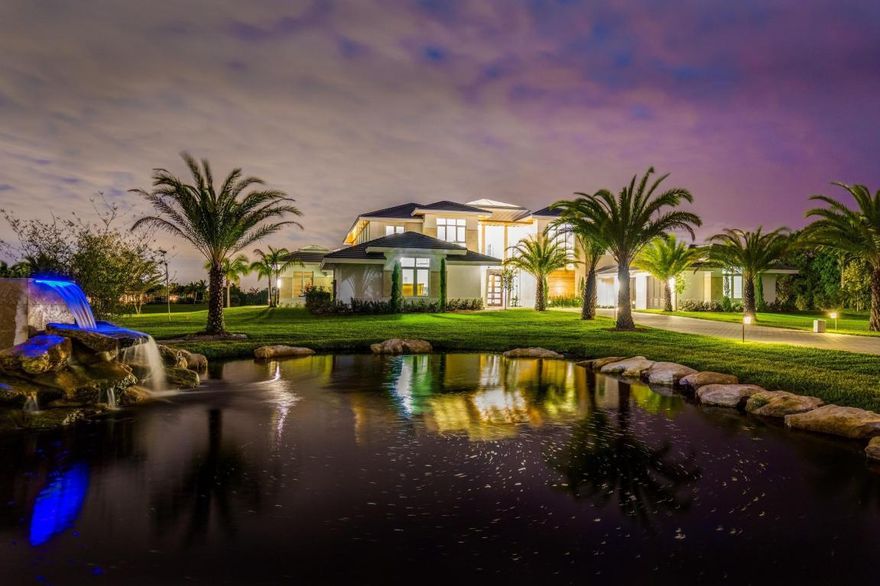 Beautiful Brand New Contemporary Home. Completely Turnkey - Fully Furnished and Decorated by Award Winning Palm Beach Decorator, Decorators Unlimited. Open Concept Floor plan. The nearly 3 acre lot offers the ultimate in privacy. Museum quality Kalwall Sky-roof centered over entrance way showers home with soft diffused light. Stunning Italian Milano Grey Marble throughout the home's first level. Breath-taking Double Island Gourmet Kitchen equipped with state-of-the art Thermidor appliances and endless storage. Share your favorite bottle of wine with your family and friends from the 750 bottle temperature controlled stainless steel and glass wine room adjacent to the impressive over sized formal dining room. After dinner relax in the pool room featuring a custom wet bar, 70 inch TV and custom hand crafted pool table. Control the LED high lights, DXV fixtures, music, pool and all the features of the home from each room on your smart phone as the home is equipped with a full Creston Smart Home System. For the golf enthusiast perfect your putting skills on the putting green wedged between flowing waters and waterfalls leading to an incredible over sized pool overlooking the expansive lake. Make your way up to the Full Concrete 2nd level with custom elevator and follow the beautiful oak floors to the amazing master bathroom featuring a one of a kind exotic rain forest green slab shower. From the sumptuous master bedroom follow the path overlooking the 1st floor and lit by the gentle light filtered by the sky roof to the bedrooms, each room equipped with its own custom bath. Relax outside in the unbelievable 2nd floor spacious outdoor patios overlooking the pool and lake.