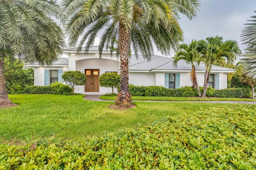 Poised upon a spacious .52-acre cul-de-sac lot east of A1A, this meticulously renovated home is just a short walk to a serene beach with private deeded access. A complete 2020 renovation brings peace of mind, including new CBS walls, metal roof, impact windows, MEPs, & refined interiors with custom finishes. Enjoy a luxurious primary suite, tall ceilings, an open-concept kitchen, & seamless indoor-outdoor living. The lushly landscaped yard features a tranquil pool/spa, complemented by extensive hardscapes, making it perfect for entertaining or unwinding. Complete with a 2.5-car garage.