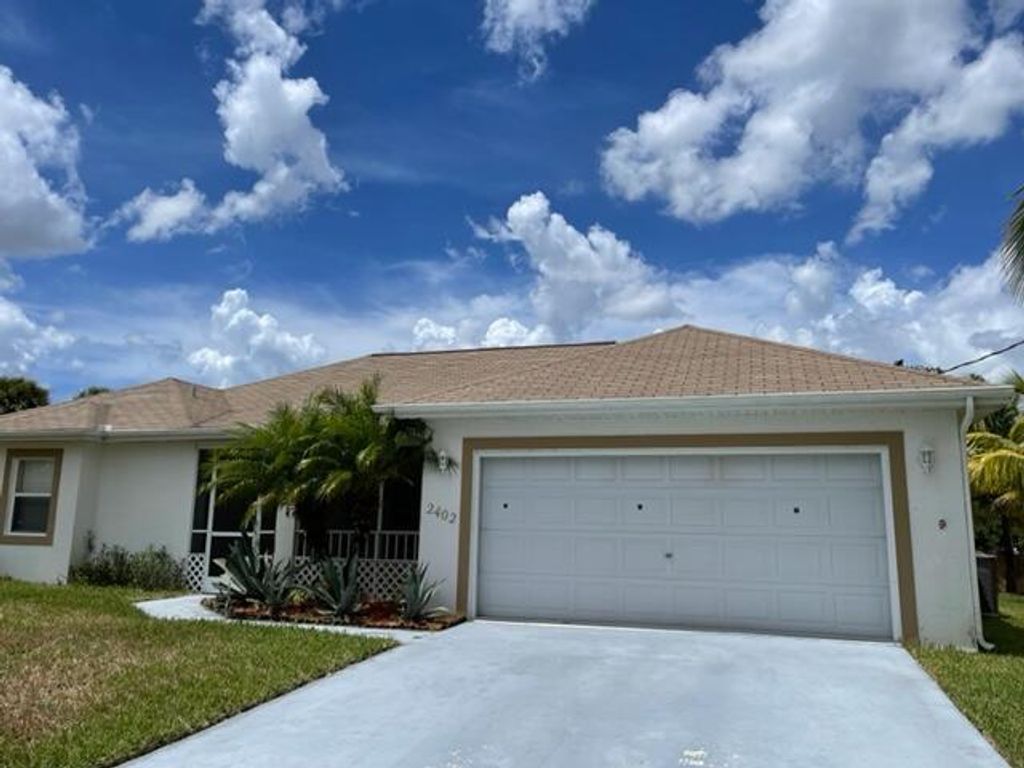 Photo of 2402 SW Waikiki Street, Port Saint Lucie, FL 34953 (MLS # R10828377)