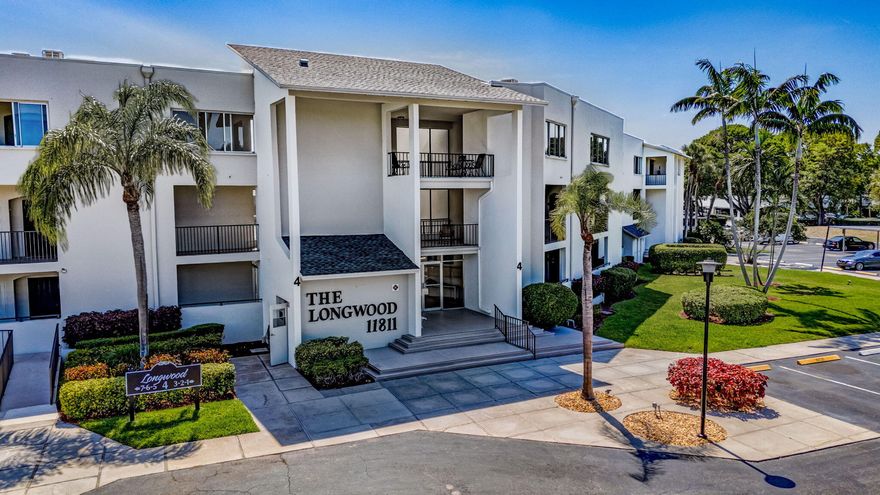 SPACIOUS FIRST FLOOR CORNER UNIT FILLED WITH NATURAL LIGHT.  BEAUTIFUL GRANITE KITCHEN WITH STAINLESS STEEL APPLIANCES.  NEUTRAL TILE FLOORING THROUGHOUT WITH CUSTOM DRAPES ON REMOTE IN LIVING ROOM.  WRAP AROUND SCREENED LANAI WITH VIEWS OF LAGOON AND POOL.  A/C & WATER HEATER 2017.  WASHER/DRYER IN UNIT.  EXTRA LARGE STORAGE UNIT.  COVERED DEEDED CARPORT #24 IN FRONT OF BUILDING.  CLOSE TO GOLF, MARINAS, BEACHES, DINING AND SHOPPING, INCLUDING THE GARDENS MALL.  MINUTES TO 95 AND THE TURNPIKE.  LONGWOOD IS A VERY POPULAR 55+ COMMUNITY, WELL MAINTAINED AND QUIET, YET WITHIN WALKING DISTANCE TO LOCAL RESTAURANTS.  PERFECT LOCATION OFF PGA BOULEVARD.