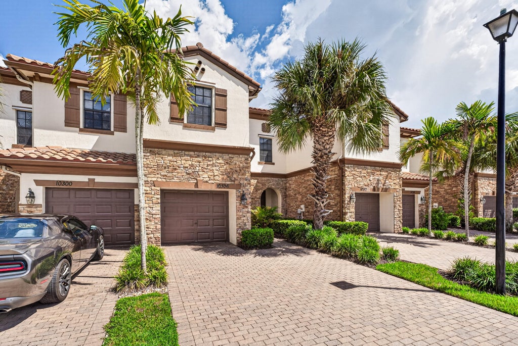 Photo of 10306 WELLINGTON PARC Drive, Wellington, FL 33449 (MLS # B26069804)