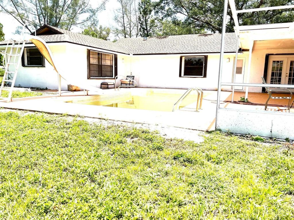 Photo of 11545 46th Place N, West Palm Beach, FL 33411 (MLS # R10973198)