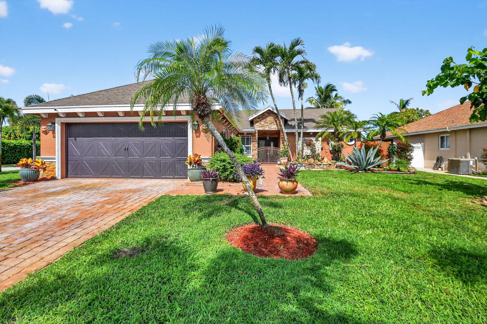 Large Corner Lot! Tropical Elegance Meets Everyday Luxury - Welcome to your personal oasis in the heart of Boynton Beach. This beautifully updated four-bedroom, two-bath single-family home in the coveted Cinnabar community blends upscale finishes with fun outdoor living, This ~1,974 sf under-air residence offers a modern chef's kitchen with sleek granite countertops, New stainless steel appliances, and generous storage. The open living and dining areas showcase porcelain tile flooring and are bathed in light through hurricane-impact windows and French doors. Thoughtful details throughout designed for both everyday comfort and entertaining. Step outside and be instantly transported to resort-style living: the backyard features a private pool complete with a dramatic rock‑style w