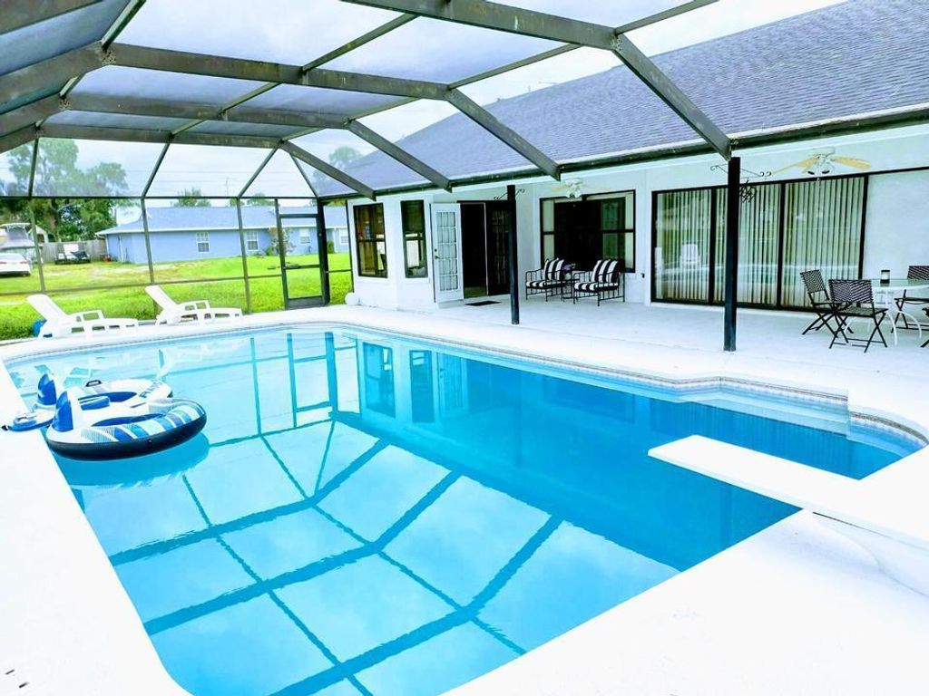 Photo of 1291 SE Ladner Street, Port St Lucie, FL 34983 (MLS # R10908279)