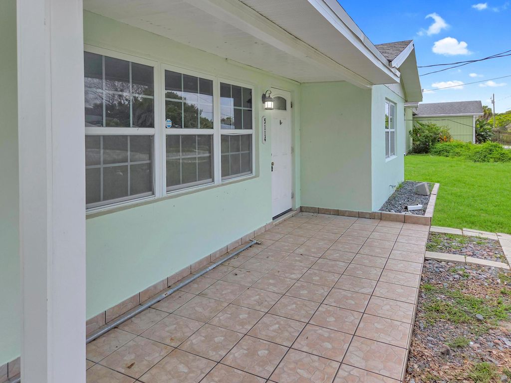 Photo of 5114 MYRTLE Drive, Fort Pierce, FL 34982 (MLS # B26056934)