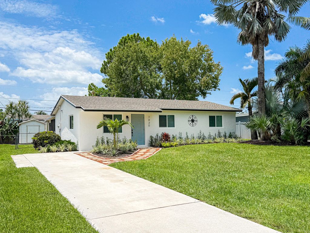 Photo of 7430 Cocoanut Drive, Lake Worth, FL 33467 (MLS # B26052517)