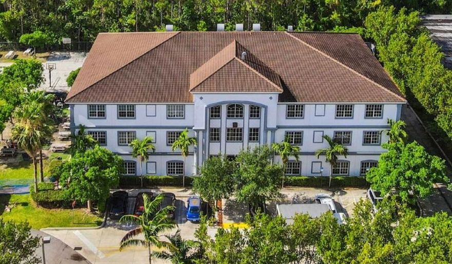 Rare single tenant NNN educational investment in Florida City's explosive South Dade growth corridor. 30,421 SF purpose built, three story K12 campus leased to Advanced Achievers Academy, a Step Up For Students scholarship recipient in continuous occupancy since 2015. Absolute NNN lease with 3% minimum annual escalations and a 15 year renewal option. Tenant pays all taxes, insurance, maintenance, and utilities. Offering includes a contiguous 1.47 acre expansion parcel with engineered plans approved for an identical mirroring facility, doubling campus capacity to 60,000+ SF. Institutional construction: steel reinforced concrete, hurricane impact glass, concrete tile roof. Less than 1 mile from Route 1 and the Ronald Reagan Turnpike. Please do not disturb tenant. All tours must be scheduled.