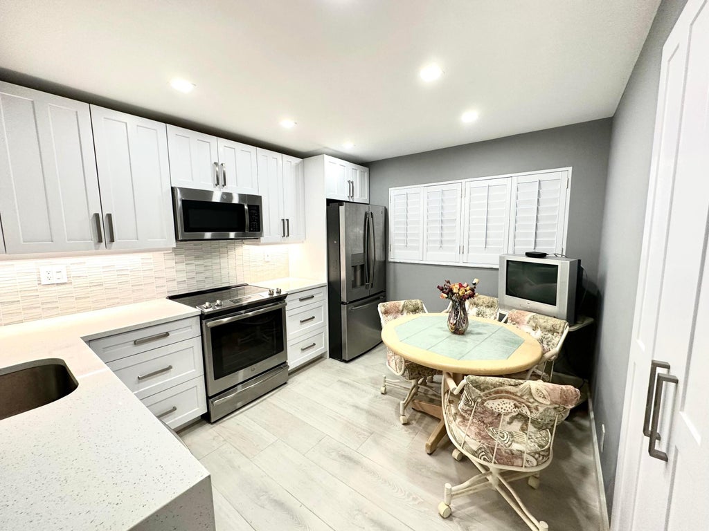 Photo of 15401 Pembridge Avenue #11, Delray Beach, FL 33484 (MLS # R10965055)