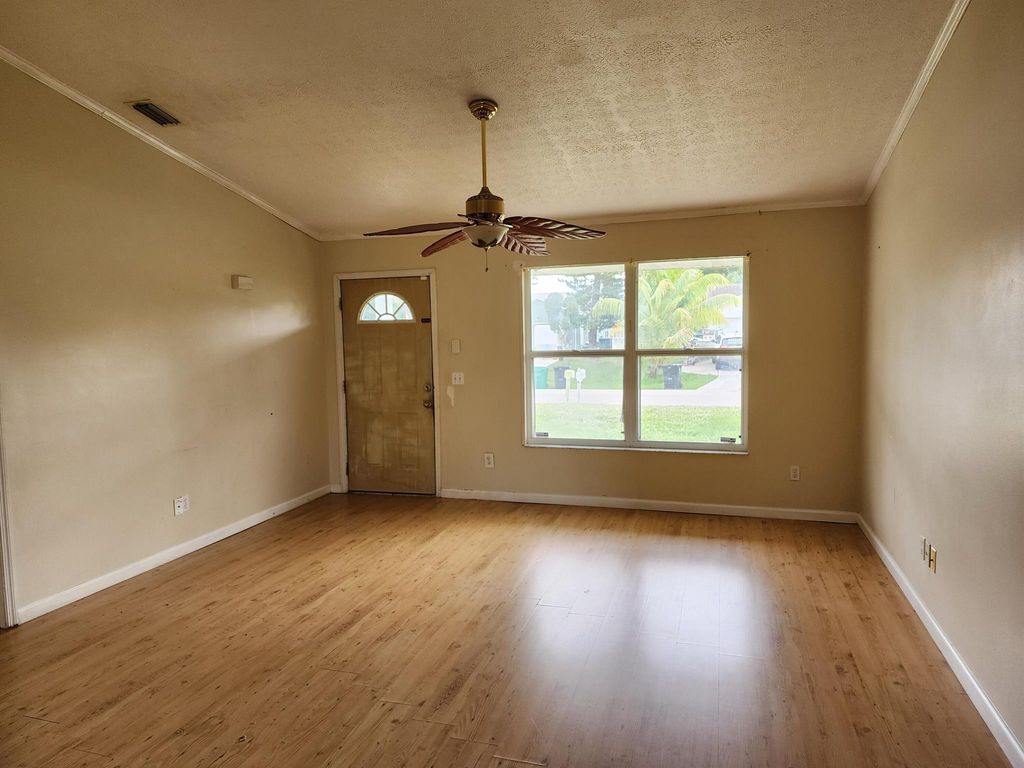 Photo of 1045 SW Coleman Avenue, Port Saint Lucie, FL 34953 (MLS # R10952541)