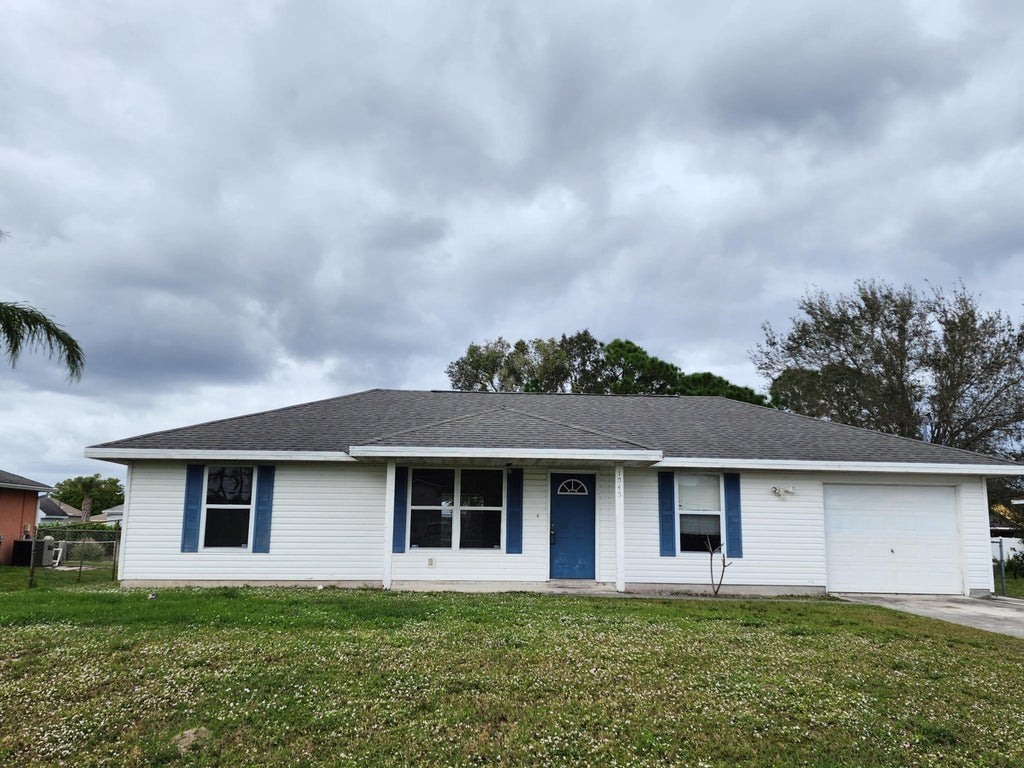 Photo of 1045 SW Coleman Avenue, Port Saint Lucie, FL 34953 (MLS # R10952541)
