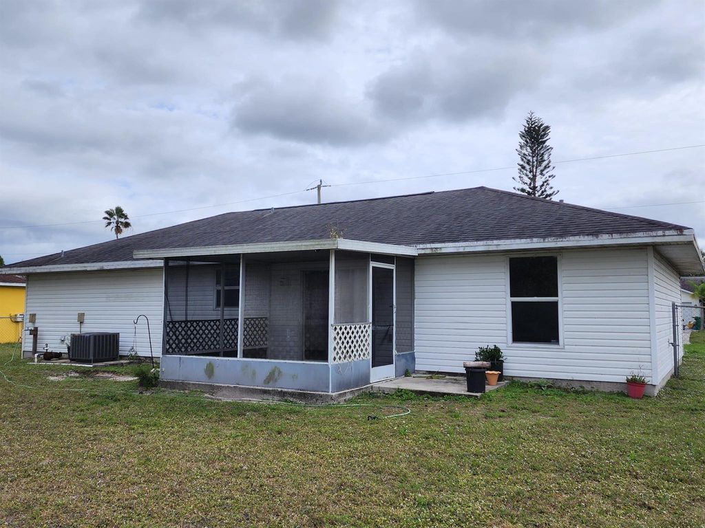 Photo of 1045 SW Coleman Avenue, Port Saint Lucie, FL 34953 (MLS # R10952541)