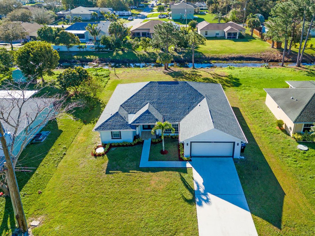 Photo of 1378 SW Glastonberry Avenue, Port Saint Lucie, FL 34953 (MLS # R10955810)