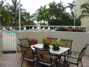 Like living in a ''resort''! Decorated and finished 2 bedroom/ 2 bath, sliding glass to 600 SF patio, close to infinity pool, public grill, fitness center, sauna, party/media room, 24 hr doorman and garage parking. Washer/Dryer in unit! Pet friendly.