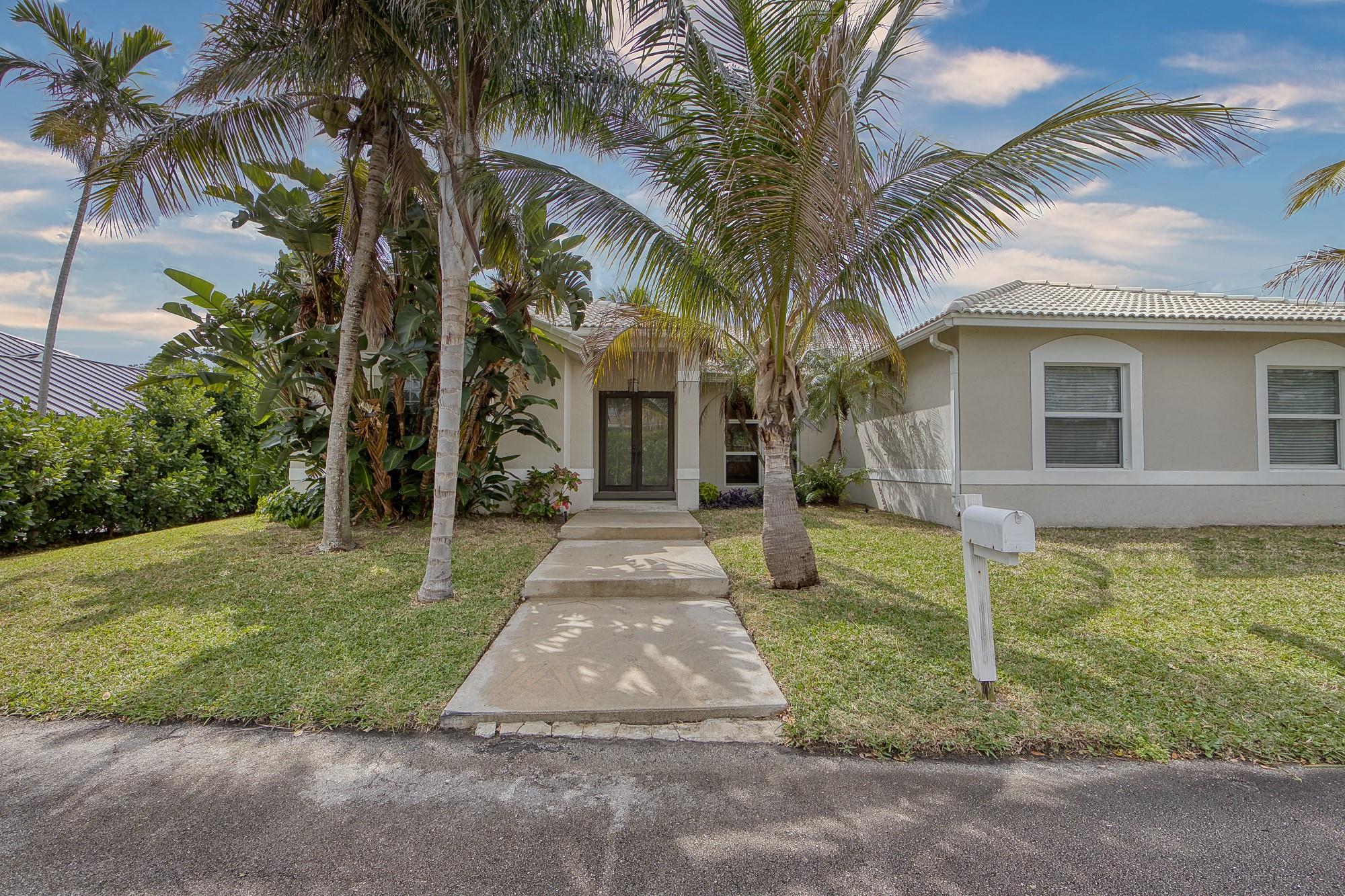 Updated single-family home in a waterfront retreat, just minutes away from the ocean. 4 bedrooms, 3 bathrooms, and a 2-car garage, this residence is a hidden gem. Engineered wood and marble flooring along with numerous upgraded appliances/elements. No HOA. Awesome location. Natural Gas inside and out. Whole house generator, HWH, Range, Dryer and drop for BBQ. Impact doors and windows. Room for pool. 24' x 24' deeded T-dock and USACE Floating Dock/Lift permit. Open ocean in 10 minutes.