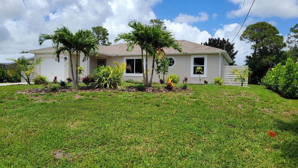 Photo of 2517 SW Hinchman Street, Port Saint Lucie, FL 34984 (MLS # R10985108)