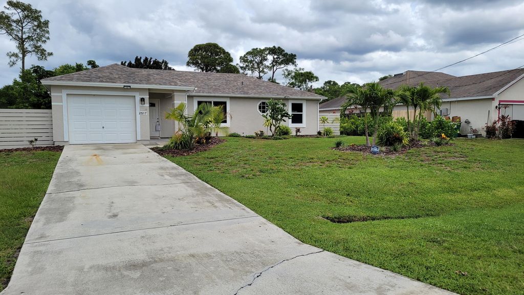 Photo of 2517 SW Hinchman Street, Port Saint Lucie, FL 34984 (MLS # R10985108)