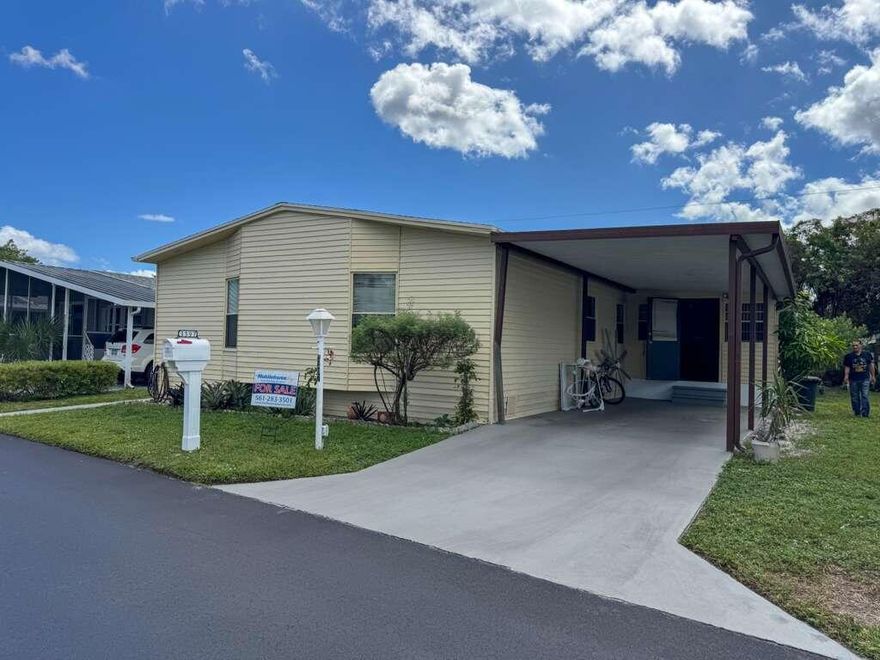 Charming Mobile Home in Lantana - 55+ Community Palm Breezes, Beautiful 2-bedroom, 2-bathroom, with a covered garage that can be used as a third bedroom, home with fantastic amenities including a pool, clubhouse, and sports courts. Prime location near shopping centers, restaurants, public transportation, and just minutes from the beach! Parking included - ready for your comfort. Great opportunity, don't miss out! .All measurements are approximate. Call the listing agent today to schedule a visit! No financing available. Sold AS IS CASH.