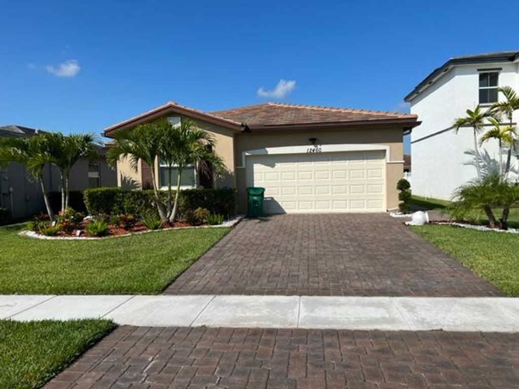 Photo of 12460 NW Mcgregor Lane, Port Saint Lucie, FL 34987 (MLS # B26009158)