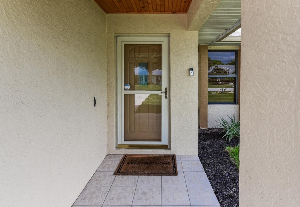 Photo of 1927 NE San Carlos Calle, Jensen Beach, FL 34957 (MLS # R11126589)