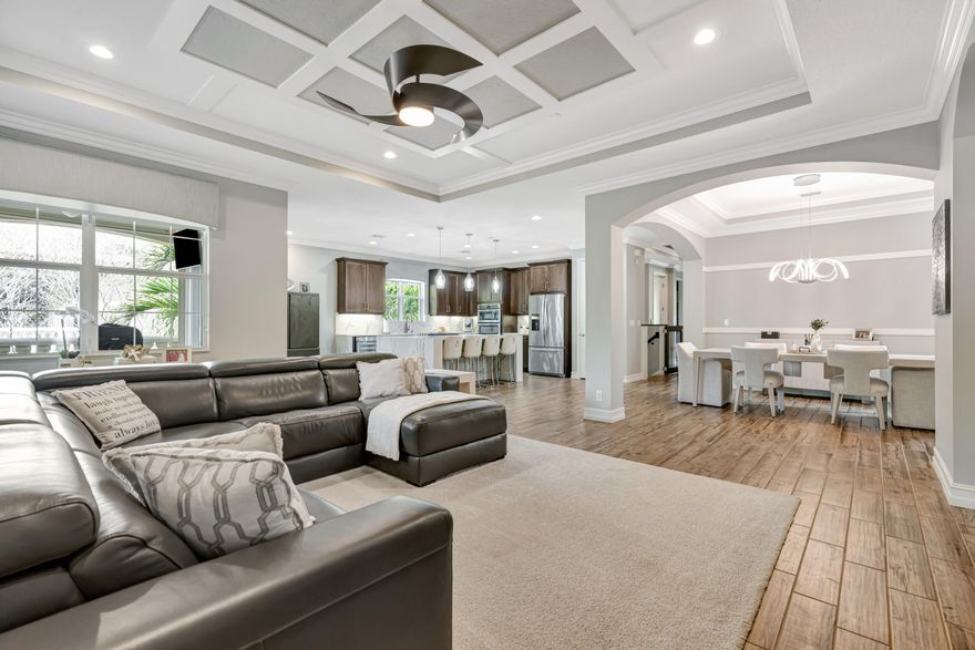 Nestled in the highly desirable Jupiter Country Club, this immaculate second-level condo has an intermediate golf membership, 3BR with en-suites, a den/office, elevator & breathtaking views of the 8th hole with spectacular sunsets. This condo truly lays out like a home boasting over 3400 square feet total. Freshly painted in 2025, the property features a beautifully renovated master bath, porcelain tile floors in the main area, new high end carpets in the bedrooms, new quartz waterfall counters, a sleek gas cooktop with wine cooler, and stainless steel appliances. The terrace boasts a TV and storm-smart retractable screens, hurricane-resistant up to 200 mph. With a climate-controlled epoxy floor garage and a refreshed second bath, this is an incredible opportunity to enjoy luxury living!  Osmosis water system in the house and outdoor patio furniture is negotiable. Jupiter Country Club is the epitome of luxury living, offering a vibrant, upscale community surrounded by lush fairways and world-class amenities. Residents enjoy a championship golf course designed for all skill levels, resort-style pools, tennis courts, a state-of-the-art fitness center, and elegant dining options. Jupiter, Florida itself is a gem—known for its pristine beaches, vibrant coastal lifestyle, and a sense of community that's both welcoming and exclusive. It's a perfect blend of natural beauty, upscale living, and year-round sunshine!