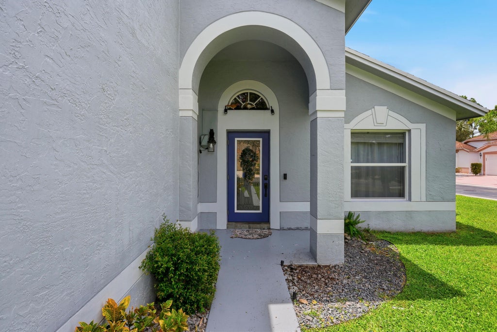 Photo of 360 Hammocks Trail, Greenacres, FL 33413 (MLS # B26059879)