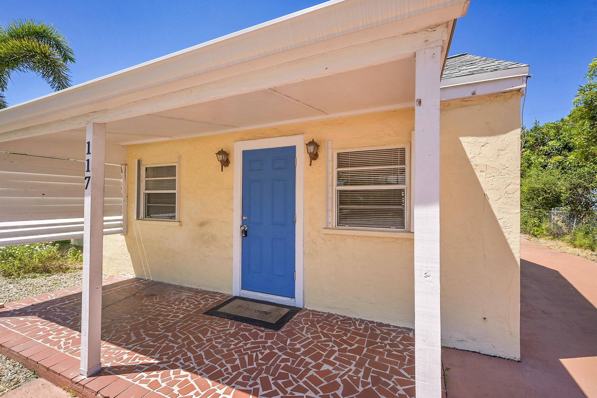 BRING YOUR TOYS! This charming 2-bedroom, 1-bath home is just 5 minutes from the beach and popular waterfront dining. Situated on a spacious lot with no HOA or restrictions, this property gives you the freedom to live the way you want. A rare find, it features an extra-large 42x28 detached garage with 12-foot ceilings, ideal for storing a boat, RV, multiple vehicles, or creating a workshop. The extended driveway provides plenty of room for parking guests and toys alike. Recent upgrades include a 2-year-old roof and 3-year-old A/C system, offering peace of mind for years to come. Whether you're searching for a primary residence, vacation retreat, or investment property, this home combines comfort, convenience, and endless possibilities in a desirable coastal location.