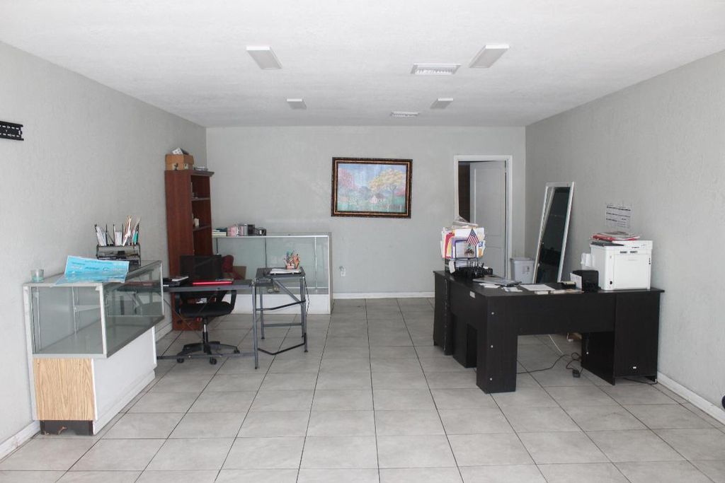 Photo of 116 SW 3rd St, Belle Glade, FL 33430 (MLS # R11130008)