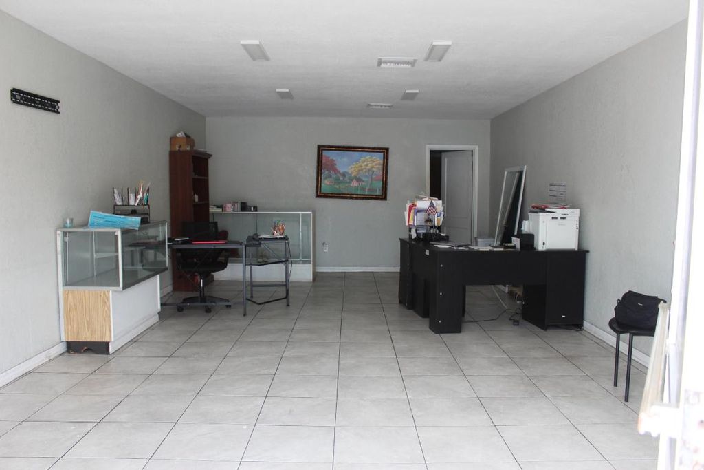 Photo of 116 SW 3rd St, Belle Glade, FL 33430 (MLS # R11130008)