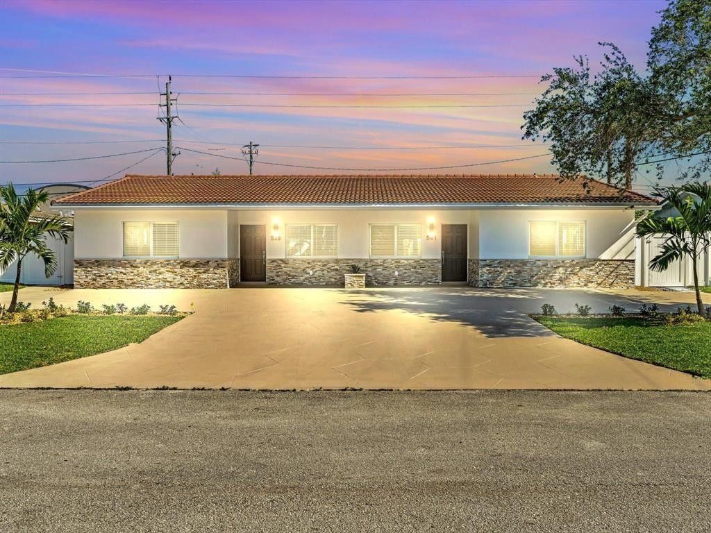 Photo of 541 NE 18th Street, Boca Raton, FL 33432 (MLS # B26018975)