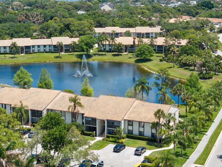 Enjoy your lake front views from this first floor unit. Updated throughout the kitchen is open and bright with ample counter space and storage. Lake views from both bedrooms and updated bathrooms make this condo move in ready. Newer AC in 22 and a tankless water heater. Community offers pool, clubhouse, tennis, pickleball and behind a gate for your privacy. "A" rated schools and just a bike ride to many shops and dinning options. Perfect for a seasonal home too.