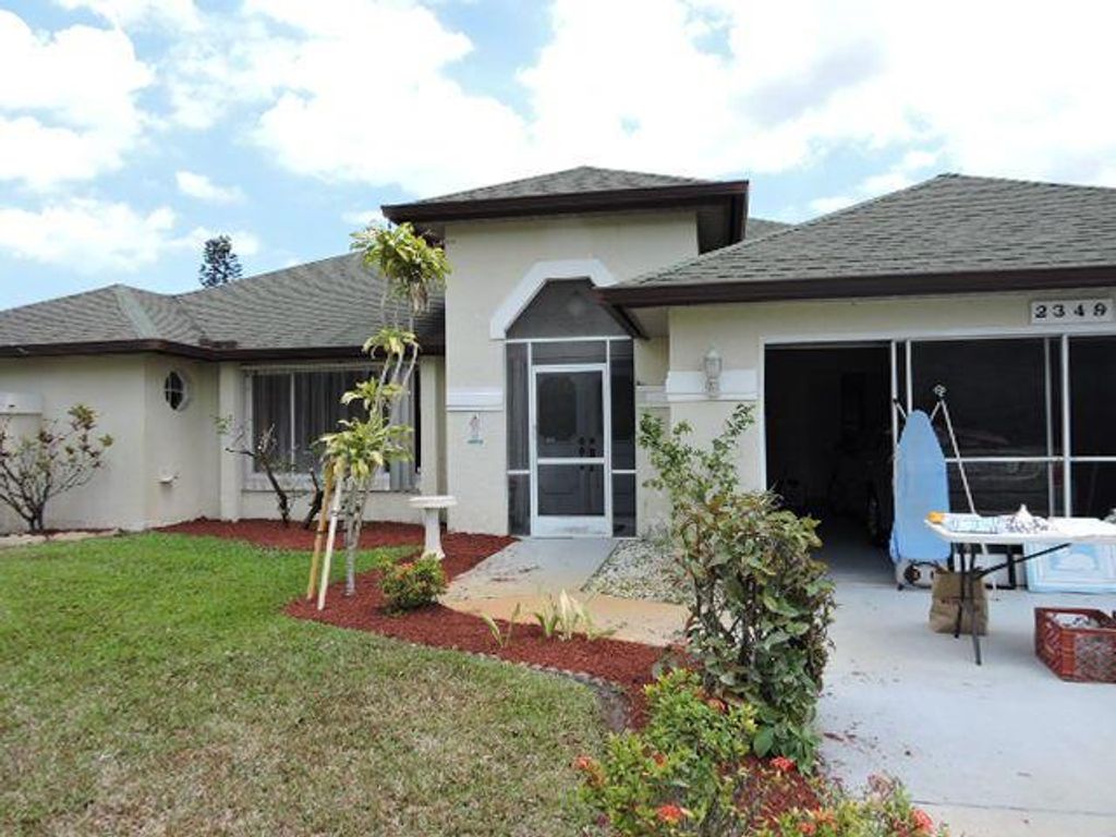 Photo of 2349 SE Pinero Road W, Port Saint Lucie, FL 34952 (MLS # R10706952)