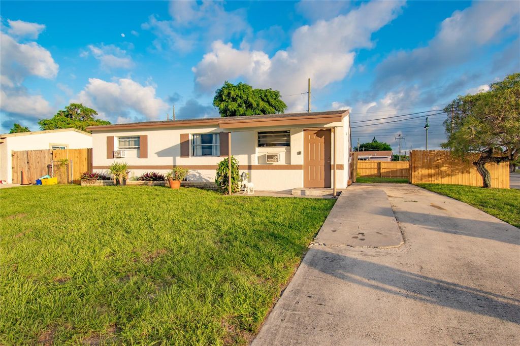 Photo of 1161 W 2nd Street, Riviera Beach, FL 33404 (MLS # F10446451)