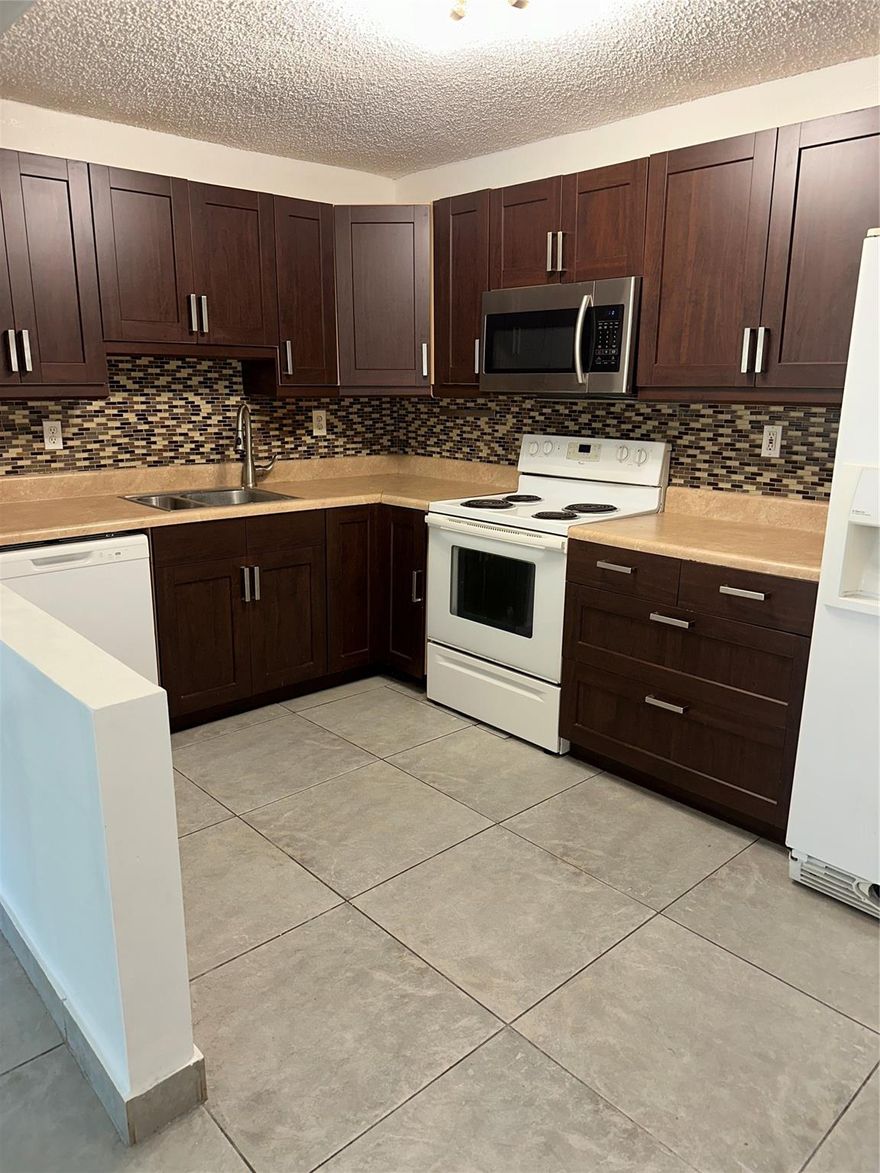 Awesome 2 "large" bedroom, 2 bath condo in the center of Coral Springs within minutes of shopping,restaurants, house of worship. This unit has lots of new updates. Kitchen and baths have been beautifully renovated. Tile floors throughout. New dishwasher, other appliances are 5 years new. Extra large screened patio. Community has 4 pools, clubhouse, exercise room, tennis and billiard room. Laundry room is just outside your door! Association states NO PETS. Minimum credit score of 650. All applicants are subject to a comprehensive screening. Available immediately.