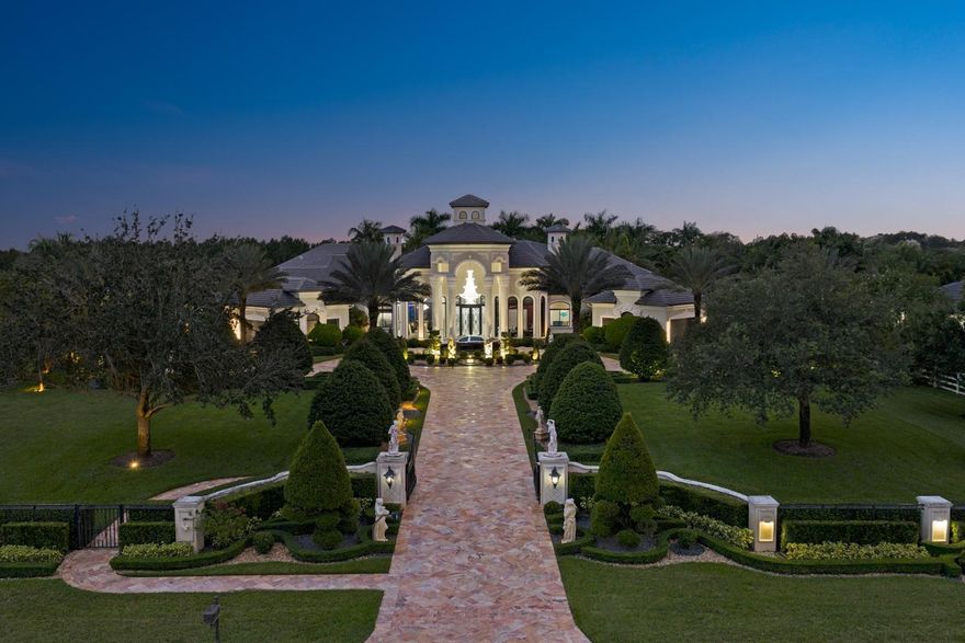 Experience grandeur and sophistication in this stunning estate within exclusive Landmark Ranch Estates. Set on 2.348 acres of meticulously landscaped grounds, the gated residence features a long private drive and resort-style pool. Perfect for entertaining, it offers a covered summer kitchen, expansive patio, soundproof theater, custom bar, sound system, two offices, and a separate 2-bedroom guest house. Car enthusiasts will love the porte-cochere and 9-car garage. The luxurious primary suite boasts a custom one-of-a-kind closet, sitting area, bonus room, and spa-inspired bath. The chef’s kitchen includes 4 ovens, 6-burner gas range, dual dishwashers, and walk-in pantry. The main house offers 4 bedrooms and 5.5 baths. New roof (2023), impact glass, and generator.