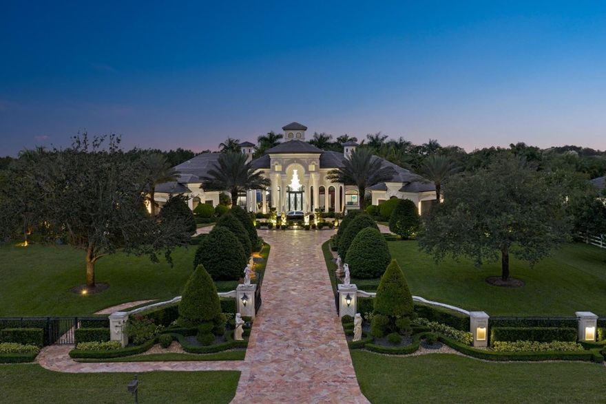 Experience grandeur and sophistication in this stunning estate within exclusive Landmark Ranch Estates. Set on 2.348 acres of meticulously landscaped grounds, the gated residence features a long private drive and resort-style pool. Perfect for entertaining, it offers a covered summer kitchen, expansive patio, soundproof theater, custom bar, sound system, two offices, and a separate 2-bedroom guest house. Car enthusiasts will love the porte-cochere and 9-car garage. The luxurious primary suite boasts a custom one-of-a-kind closet, sitting area, bonus room, and spa-inspired bath. The chef’s kitchen includes 4 ovens, 6-burner gas range, dual dishwashers, and walk-in pantry. The main house offers 4 bedrooms and 5.5 baths. New roof (2023), impact glass, and generator.