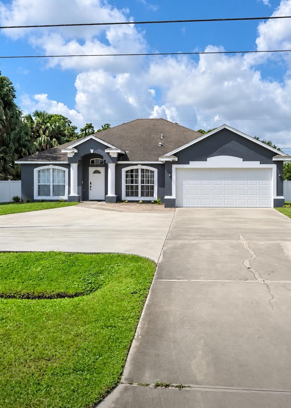 Photo of 1402 SW CALIFORNIA Boulevard, Port Saint Lucie, FL 34953 (MLS # B26079830)