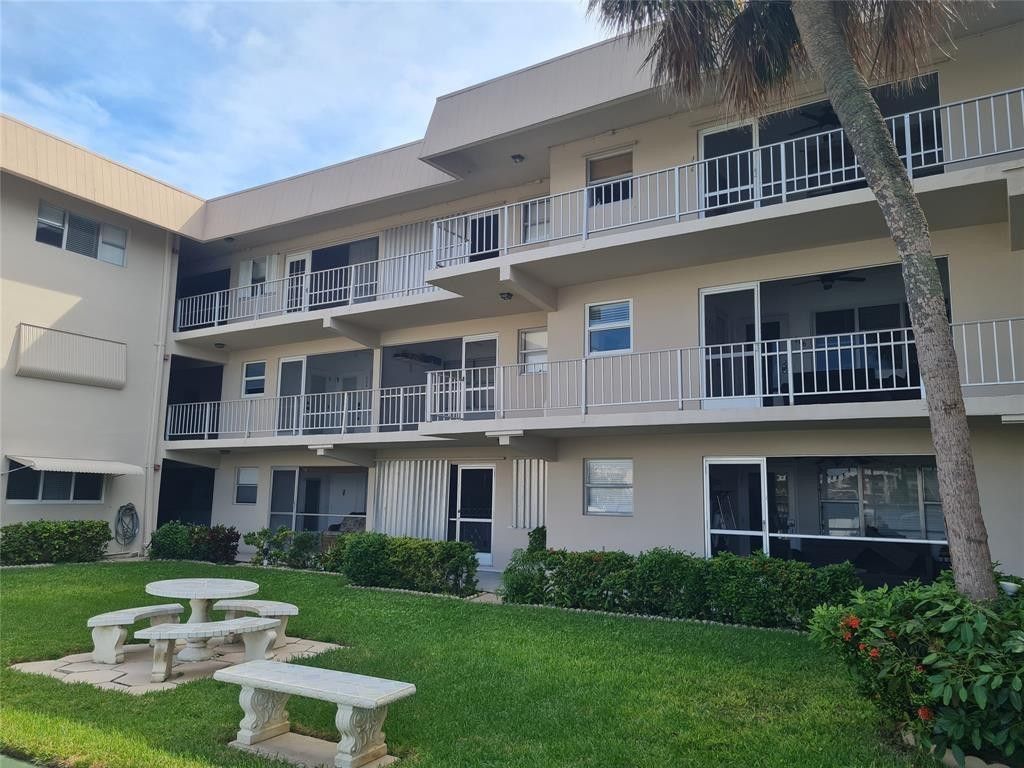 Photo of 300 Golden Isles Drive #104, Hallandale Beach, FL 33009 (MLS # B26026816)