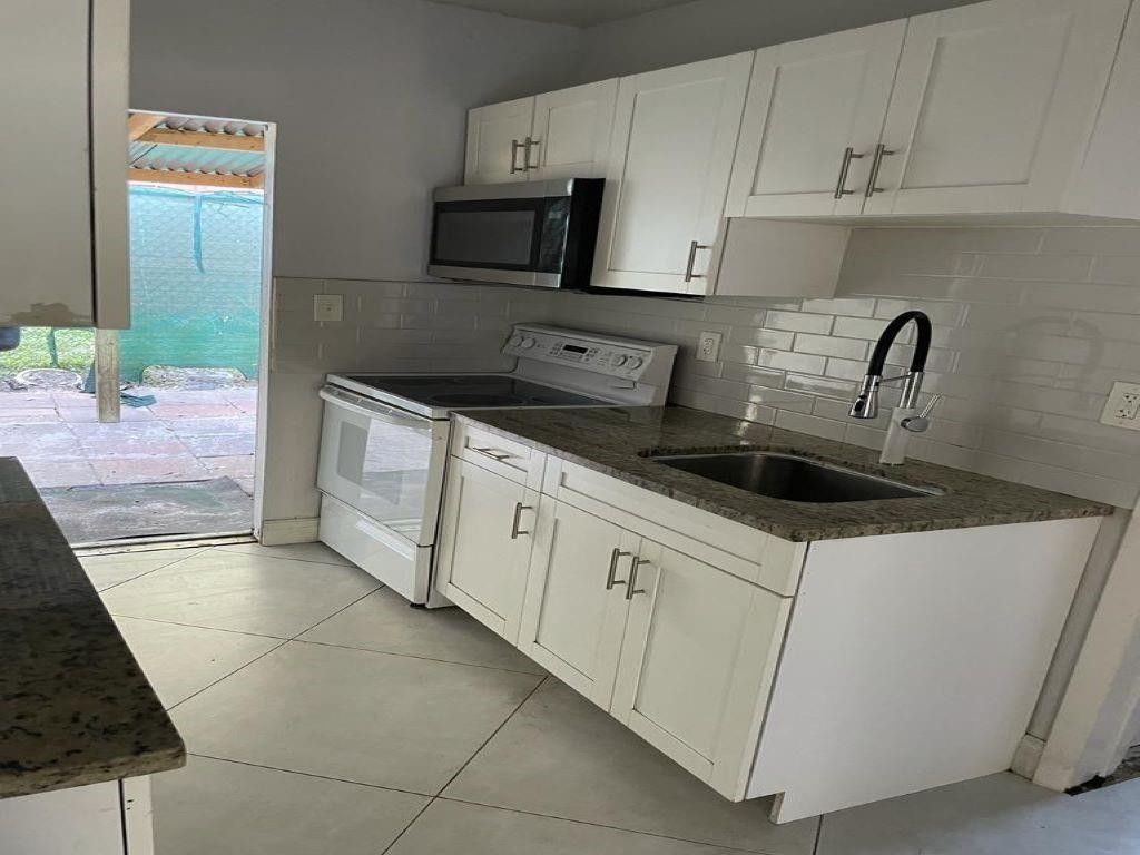 Photo of 103 NW 7th Avenue #F, Pompano Beach, FL 33060 (MLS # F10421954)