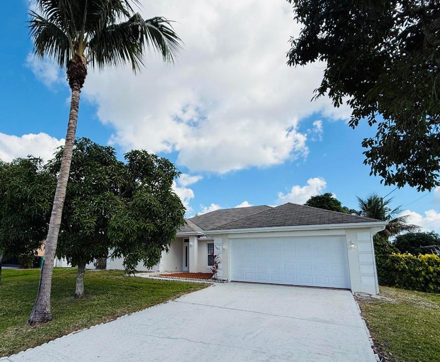 Beautifully maintained and move-in ready, this 4-bedroom, 3-bath home offers a spacious split-bedroom layout with a Jack-and-Jill bathroom! Tile and wood laminate flooring throughout. Recent updates include a ROOF replaced in 2021 and a brand-new AC installed July 2025. Enjoy a 2-car garage, a fully fenced backyard with banana, avocado, and mango trees, and a private well ready for a future sprinkler system. Nestled in a quiet, friendly neighborhood and just minutes from Tradition, shopping, I-95, and the Turnpike—this home blends convenience, charm, and modern updates in one exceptional package.