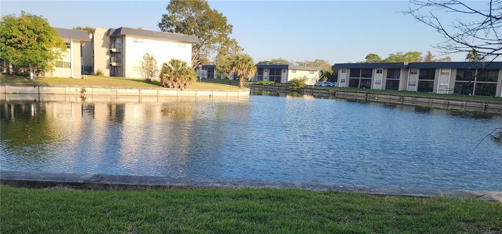 FIRST floor unit-End Unit with water views in back and garden views-parking in front. NEW A/C - ALSO NEW REFRIGERATOR Also Kitchen Counter top replaced. New WASHER AND DRYER . ALL 1 year old-W/D Next to the Kitchen Some other Upgrades done thru-out the unit. Many Amenities: Pool, Tennis, Guest Parking, Common areas ETC. Fast Approval.