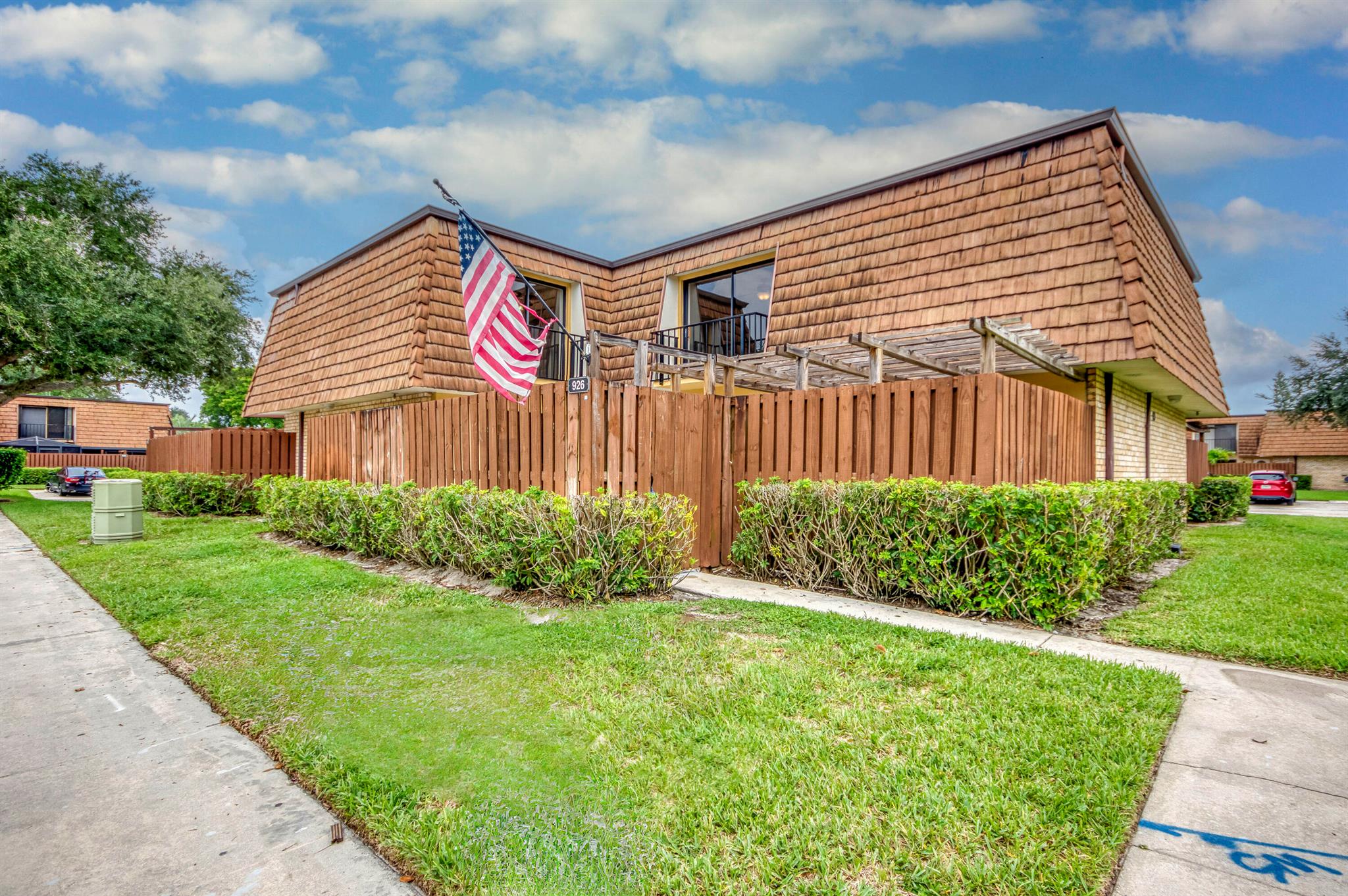 Move-in ready and designed for both comfort and outdoor living! This beautifully maintained 3 bedroom, 3 full bath quad townhouse offers a bright, open layout with tile flooring throughout, fresh interior paint, and a newly painted private fenced patio, perfect for outdoor dining and relaxing in your own private oasis. The spacious floor plan includes a versatile first-floor bedroom and full bath, ideal for guests, a home office, or a private retreat. Upstairs, the primary suite features his-and-her closets, including a large walk-in, while the convenience of an upstairs laundry makes everyday living effortless. Set within a lushly landscaped community filled with mature trees and greenery, residents enjoy amenities such as a renovated Olympic-size pool, playgrounds, and courts for