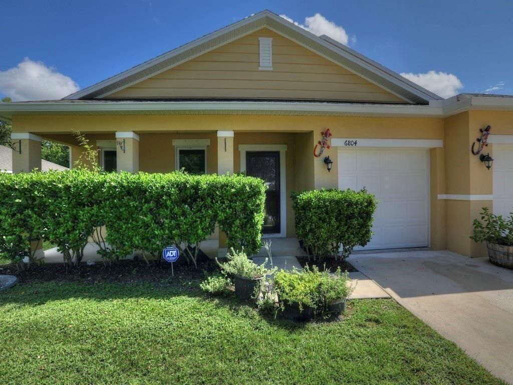 Photo of 6804 NW Garbett Street, Port Saint Lucie, FL 34983 (MLS # R10952104)