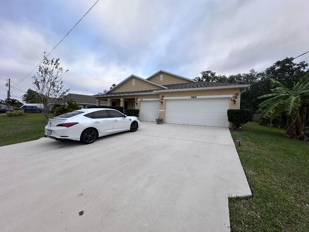 Photo of 6804 NW Garbett Street, Port Saint Lucie, FL 34983 (MLS # R10952104)