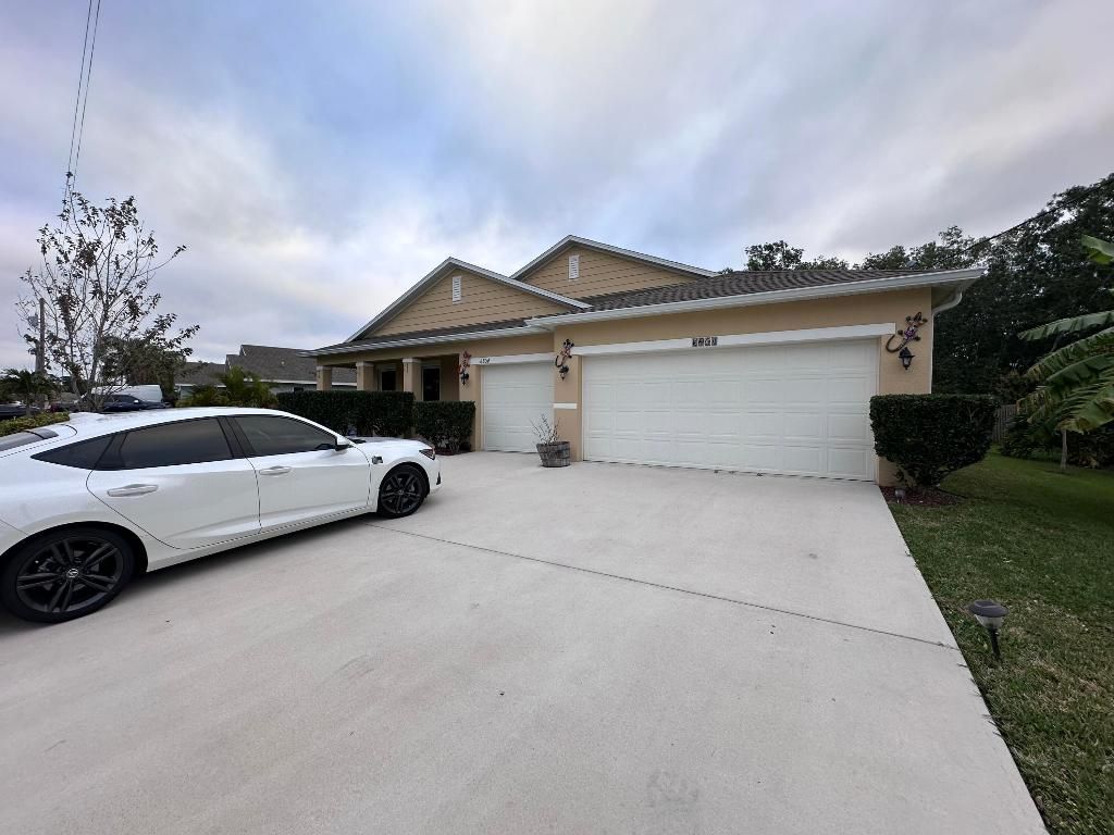 Photo of 6804 NW Garbett Street, Port Saint Lucie, FL 34983 (MLS # R10952104)