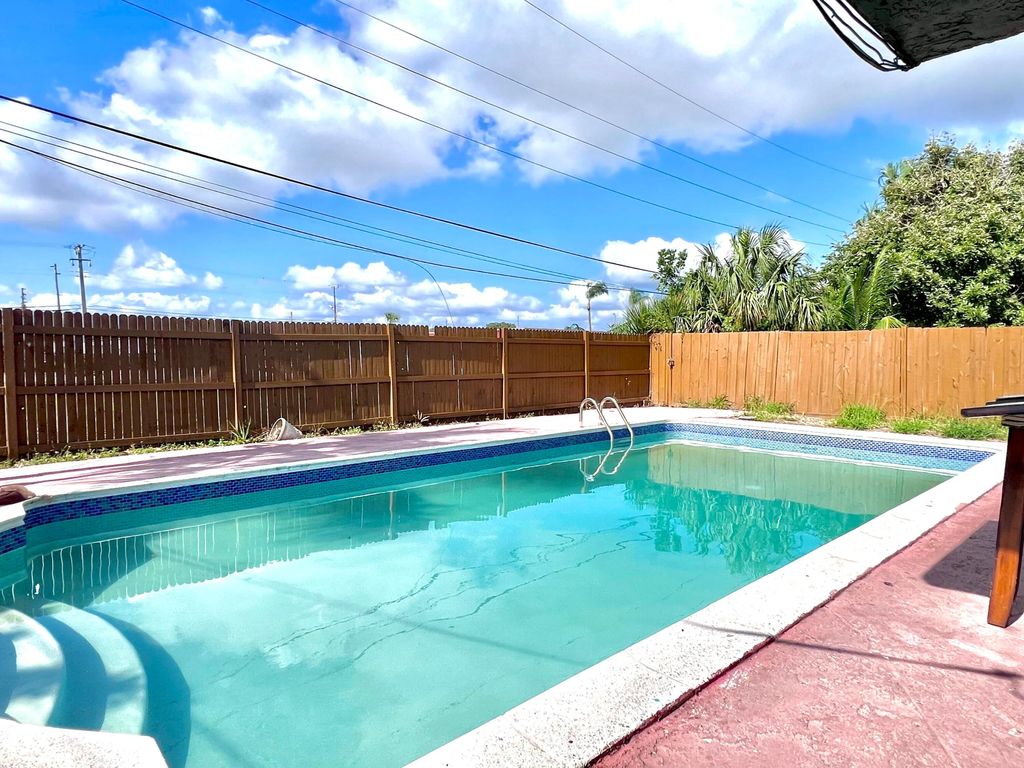 Photo of 824 Bayberry Drive #1, 2, &amp; 3 : Triplex, Lake Park, FL 33403 (MLS # R10989317)