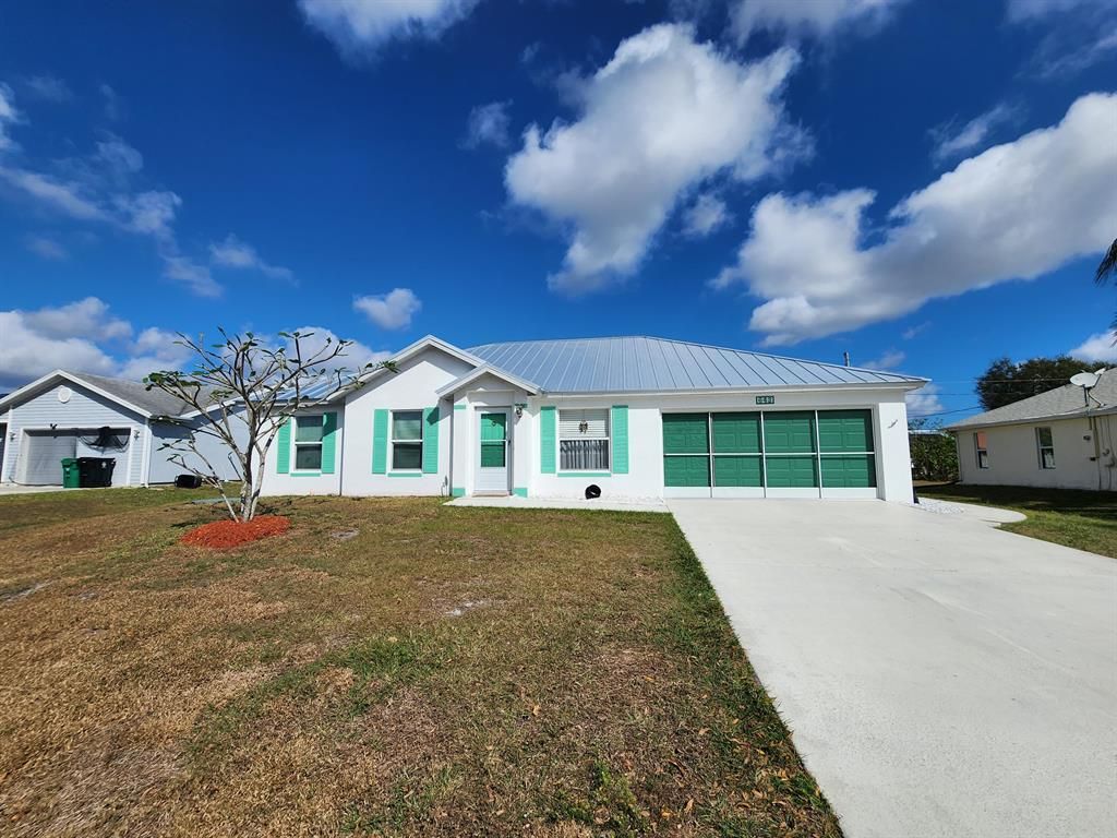 Photo of 643 SW Hillsboro Circle, Port St Lucie, FL 34953 (MLS # R10863694)