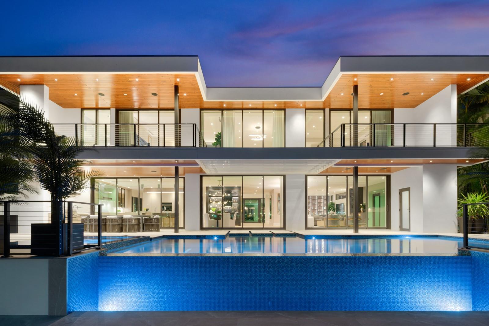 COMPLETE RENOVATION FINISHED IN APRIL 2024. Absolutely stunning modern waterfront estate with ultra high-end finishes. Enchanting wide water views of the intracoastal, ocean inlet, & a parade of cruise ships & yachts. Walking distance to Pier 66, dining, and beaches. 10 mins to FLL airport. Floor-to-ceiling sliding glass doors, floating staircase w/ glass banister, massive glass pivot door, custom Italian cabinets & porcelain tile throughout, Miele appliances, 3 wet bars, club room, & 1st floor suite, optional 6th bedroom. 2 primary suites w/ spa baths & expansive closets, 2nd floor lounge all with water views. 4 private terraces, motorized curtains/shades, SMART glass, 11 ft ceilings on 2nd floor, outdoor kitchen with covered dining, ample entertaining space, and resort style pool & spa.